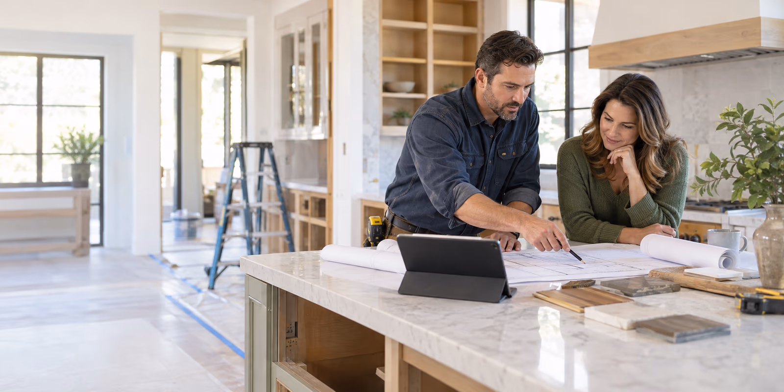 Illustrative scene of a contractor and homeowner reviewing kitchen remodeling plans
